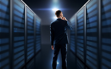 Image showing businessman over server room background