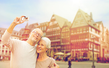 Image showing senior couple with camera traveling in frankfurt