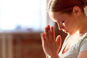 Image showing close up of woman meditating at yoga studio