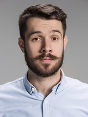 Image showing The young man looking at camera