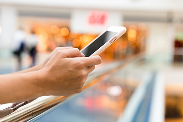 Image showing Woman use of mobile phone in shopping mall