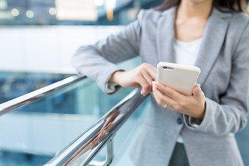 Image showing Business woman working on cellphone