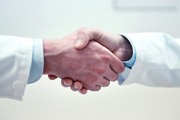 Image showing close up of doctors hands making handshake