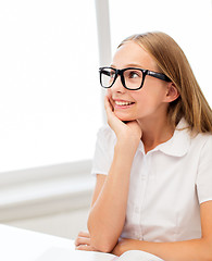 Image showing happy student girl in glasses with book at school