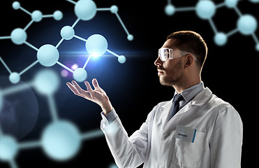 Image showing scientist in lab coat and goggles with molecules