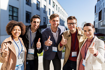 Image showing business team with conference badges in city