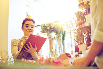 Image showing florist woman and man making order at flower shop