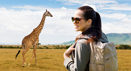 Image showing happy woman with backpack traveling in africa