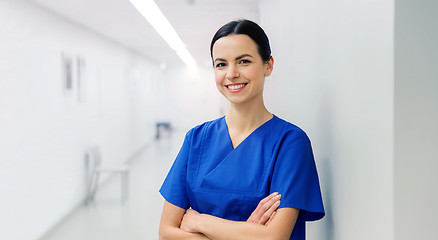 Image showing happy doctor or nurse at hospital corridor