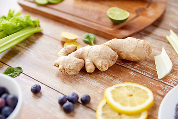 Image showing ginger, fruits, berries and vegetables on table