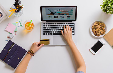 Image showing hands with laptop and credit card at table