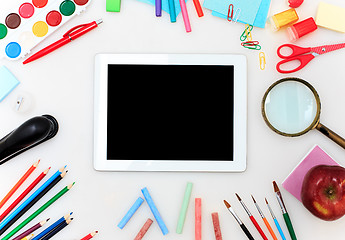 Image showing School set with notebooks, pencils, brush, scissors and apple on white background