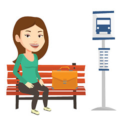 Image showing Business woman waiting at the bus stop.