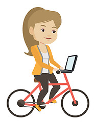 Image showing Woman riding bicycle in the city.