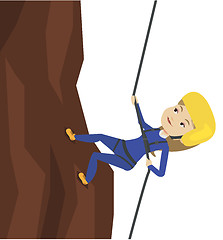 Image showing Woman climbing in mountains with rope.