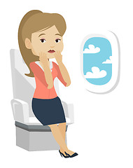 Image showing Young woman suffering from fear of flying.