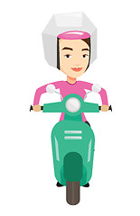 Image showing Woman riding scooter in the city.