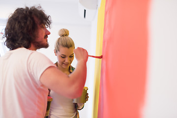 Image showing couple painting interior wall