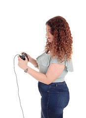 Image showing Woman playing her video game.