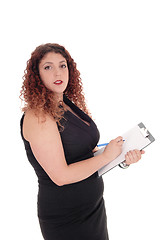 Image showing Business woman with clipboard.