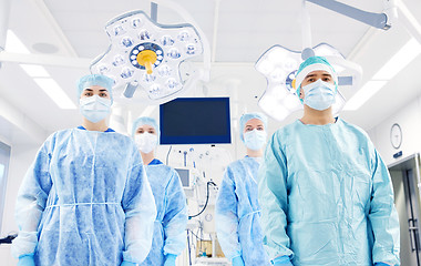 Image showing group of surgeons in operating room at hospital