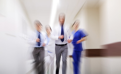 Image showing group of medics walking along hospital