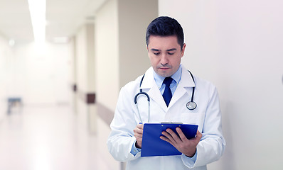 Image showing doctor with clipboard at hospital corridor