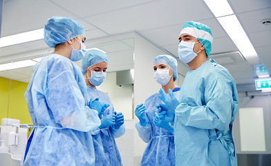 Image showing group of surgeons in operating room at hospital