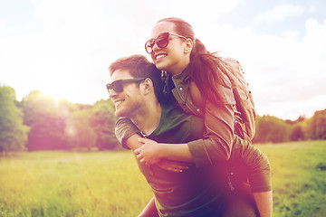 Image showing happy couple with backpacks having fun outdoors