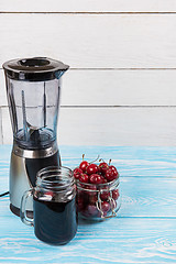 Image showing Cherry juice with glass of berries