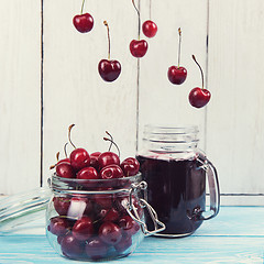 Image showing Cherry juice with glass of berries