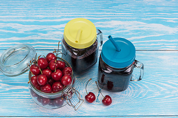 Image showing Cherry juice with glass of berries