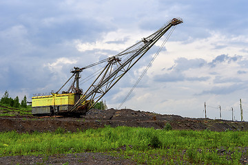 Image showing Excavator machine at excavation earthmoving work in quarry