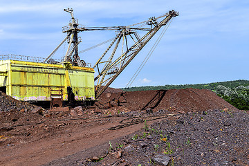 Image showing Excavator machine at excavation earthmoving work in quarry