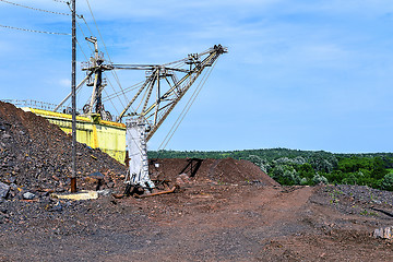 Image showing Excavator machine at excavation earthmoving work in quarry