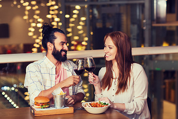 Image showing couple dining and drinking wine at restaurant