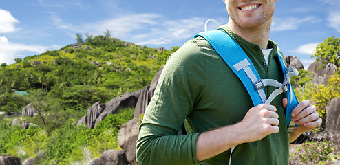 Image showing close up of happy man with backpack traveling