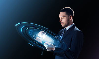 Image showing businessman with tablet pc and virtual projection