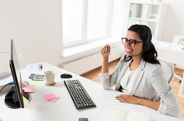 Image showing businesswoman with headset and computer at office