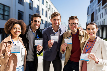 Image showing business team with conference badges in city