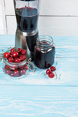 Image showing Cherry juice with glass of berries