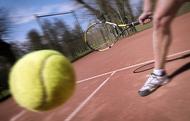 Image showing Tennis player stretches to play ball