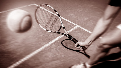 Image showing Tennis player stretches to play ball 