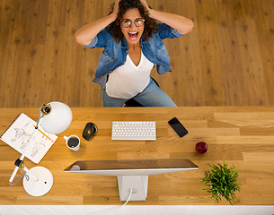 Image showing Stressed woman working