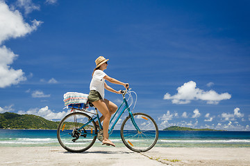 Image showing Woman ride along The Beach