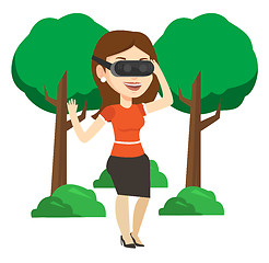 Image showing Woman wearing virtual reality headset in the park.