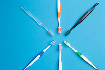 Image showing Colorful toothbrushes , place for inscription