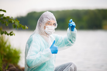 Image showing Laboratory assistant with test tube