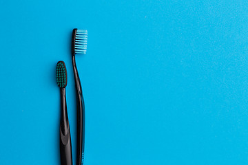 Image showing Black toothbrushes , space for text