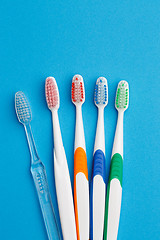 Image showing Photo of five colored toothbrush